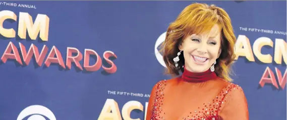  ?? ISAAC BREKKEN/GETTY IMAGES ?? Reba McEntire hosted the 53rd Academy of Country Music Awards on Sunday. The night’s big winners included Chris Stapleton and Miranda Lambert.