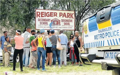  ?? Picture: Mduduzi Ndzingi ?? Community members gather after videos emerged that allegedly showed the school headmaster, who has resigned, engaging in sex acts with pupils.