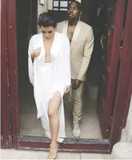  ?? KENZO TRIBOUILLA­RD / AFP / GETTY IMAGES FILES ?? Kim Kardashian and Kanye West leave their residence ahead of their 2014 wedding. Jamil Jivani says news of
their possible divorce hit him hard.