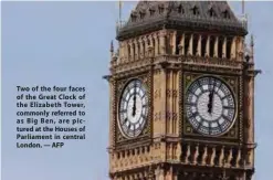  ??  ?? Two of the four faces of the Great Clock of the Elizabeth Tower, commonly referred to as Big Ben, are pictured at the Houses of Parliament in central London. — AFP