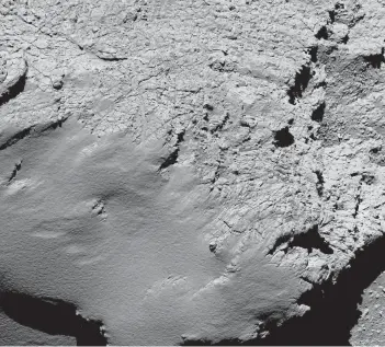  ?? EUROPEAN SPACE AGENCY VIA ASSOCIATED PRESS ?? This image of Comet 67P/Churyumov-Gerasimenk­o was taken by the Rosetta probe about 5.7 km above the surface as the probe began its final descent onto the surface of the comet.