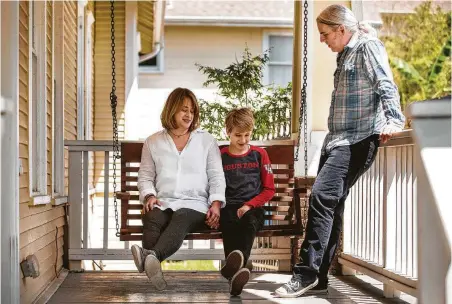  ?? Photos by Brett Coomer / Staff photograph­er ?? Isaac Heider, 12, with parents Carol and Clinton, is an only child and misses going to school where he can see his friends.