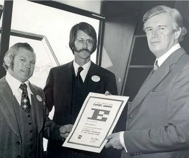  ??  ?? Interlock founders Ron Davis and Stuart Young, centre, receive the Trade Promotion Export Award from deputy prime minister Brian Talboys in 1976.