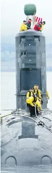  ?? DARREN STONE, TIMES COLONIST ?? Workers prepare HMCS Chicoutimi for a dive to verify the submarine’s watertight integrity at Ogden Point on April 16, 2014.