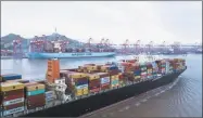  ?? Qilai Shen / Bloomberg ?? The Soro Enshi container ship, operated by Maersk, sails from Yangshan Deep Water Port in Shanghai.