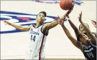  ?? David Butler II / Associated Press ?? UConn forward Aubrey Griffin ( 44) works for the rebound against Georgetown in the second half on Saturday in Storrs.