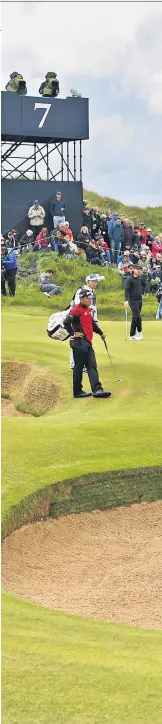  ??  ?? Sand and deliver: Brooks Koepka hits out of a bunker at the seventh