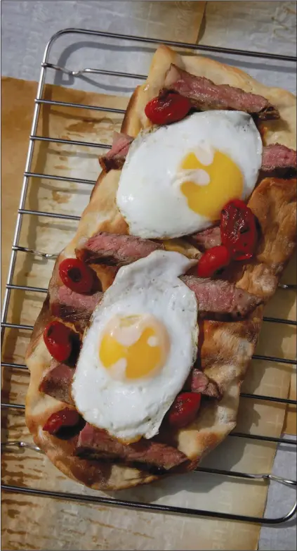  ?? (TNS/St. Louis Post-Dispatch/Hillary Levin) ?? Steak and Eggs Flatbread