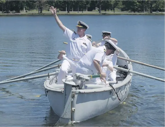  ?? ADRIAN WYLD/THE CANADIAN PRESS ?? Royal Canadian Navy Vice-Admiral Mark Norman waves goodbye as he is traditiona­lly rowed away in a whaler after stepping down as the head of the Royal Canadian Navy in a ceremony last June in Ottawa. Prime Minister Justin Trudeau is backing the decision...