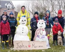  ?? Photo by Christy Riordan ?? Marian, John and Sadhbh O’Sullivan, Con and Tadhg O’Sullivan, John and Marian Murphy, Margaret Daly, Sinead and Aisling O’Sullivan with snowman John and snow women Marian at Cahersivee­n on Friday.