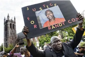  ?? ARNOLD GOLD / NEW HAVEN REGISTER ?? The Cox’s family attorney Benjamin Crump at a “Justice for Randy Cox” march. Five New Haven, Conn., police officers were charged with misdemeano­rs over their treatment of Cox, who was paralyzed in the back of a police van.