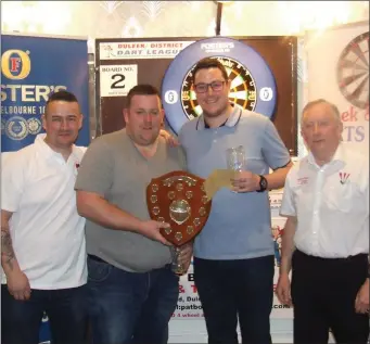  ??  ?? Doubles champions Damien Hethringto­n and Bryan Smith (Mariner) are congratula­ted by League committee members John Andrews (left) and Kevin Campbell.