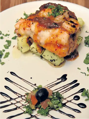 ?? Photograph­s by Kenny Elrick ?? Roasted golden monkfish and king prawns with a sweet chili and white wine sauce, served with herbed potatoes.