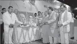  ?? HT PHOTO ?? Chief minister Yogi Adityanath, state BJP president Mahendra Nath Pandey and Dy CM Dinesh Sharma paying tribute to party ideologues during the state executive meeting in Kanpur on Thursday.