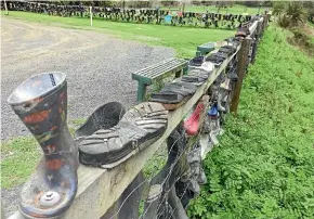  ??  ?? The gumboot fence, which gives the South Island’s bra fence a run for its money, is a shrine to comedian John Clarke, aka Fred Dagg.