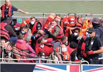  ?? ?? Picked up: Migrants rescued in the Channel are brought into Dover on Saturday