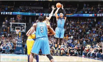  ?? GARRETT ELLWOOD/NBAE/GETTY IMAGES/AFP ?? Russell Westbrook of the Oklahoma City Thunder shoots a 3-pointer against the Denver Nuggets at the Pepsi Center in Denver, Colorado, on January 20, 2013.