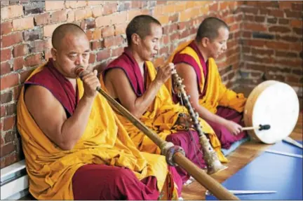  ?? RACHEL WISNIEWSKI — FOR DIGITAL FIRST MEDIA ?? Monks blow into horns, bang drums and play chimes in the opening ceremony.