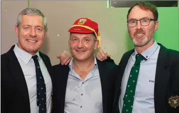  ??  ?? 1993 Lions captain Gavin Hastings presenting Nick Popplewell with his Lions Cap from the 1993 tour with incoming Greystones RFC president Victor Megannety.