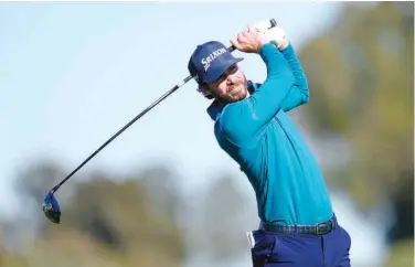  ?? Associated Press ?? ↑
Sam Ryder hits a tee shot on the 18th hole during the first round of the Farmers Insurance Open at Torrey Pines in San Diego on Wednesday.