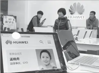  ?? CP PHOTO ?? A profile of Huawei’s chief financial officer Meng Wanzhou is displayed on a computer at a Huawei store in Beijing on Thursday.