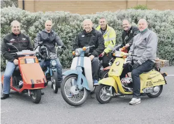  ??  ?? Steve Milner, centre,with moped riders who will ride from Castletown to Barnard Castle.