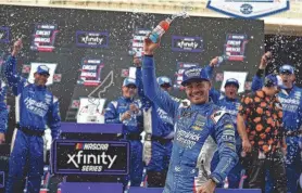  ?? ?? Kyle Larson celebrates winning the NASCAR Xfinity Series race in Texas on March 23. Larson also won last year’s Cup Series race at Richmond, the site of NASCAR racing this weekend.