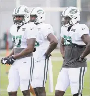  ?? Seth Wenig / Associated Press ?? Jets’ tight ends Clive Walford, left, Neal Sterling, center, and Chris Herndon look on during a recent practice.