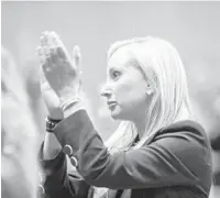  ?? ?? Florida Senate Minority Leader Lauren Book claps at the end of the speech by Demings. The congresswo­man said women “are going to fight and fight and fight some more.”