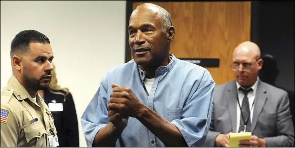  ?? JASON BEAN/THE RENO GAZETTE-JOURNAL VIA AP, POOL ?? In this July 20, 2017, file photo, former NFL football star O.J. Simpson reacts after learning he was granted parole during a hearing at the Lovelock Correction­al Center in Lovelock, Nev.