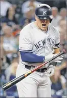  ??  ?? Yankees first baseman Luke Voit reacts to a flyout in the eighth inning of Tuesday night’s 12-11 loss to the Tigers in Detroit.