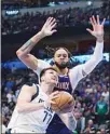  ?? ?? Dallas Mavericks guard Luka Doncic (77) drives to the basket against Phoenix Suns center JaVale McGee (right), during the second half of Game 3 of an NBA basketball second-round playoff series in Dallas. (AP)