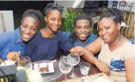  ?? PHOTO CONTRIBUTE­D Chef Andre ‘Cooks’ Sewell (second right) shares a moment with diners Gleasia Reid (left), Shawna-Kay Burton (second left), and Sasha-Gay West at the launch of Restaurant Week 2018, held on the lawns of Devon House in St Andrew on Sunday, ??