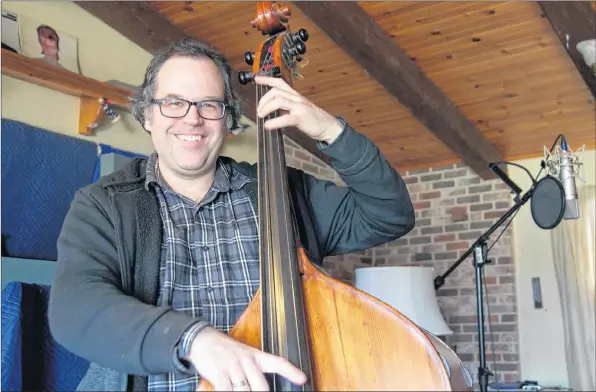  ?? SARA ERICSSON ?? Kory Bayer has played bass since junior high, and studied classical music, majoring with his upright bass, at McGill. Now, he’s the soundman at SoundMarke­t Recording Studios.