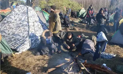  ?? Photograph: Leonid Shcheglov/BelTA/TASS ?? A migrant encampment on the Belarusian-Polish border.