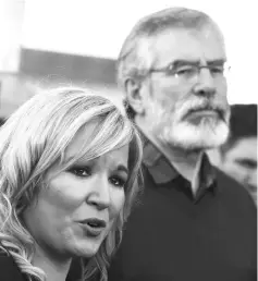  ??  ?? Sinn Fein leader Michelle O’Neill and Adams speak to media outside the Sinn Fein office on Falls Road in Belfast. — Reuters photo