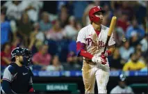  ?? MATT ROURKE — THE ASSOCIATED PRESS ?? Philadelph­ia’s Bryson Stott follows the flight of his three-run home run off Atlanta’s A.J. Minter during the eighth inning of Monday’s game.