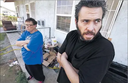  ?? Al Seib
Los Angeles Times ?? BETTY ROBISON and her son Sean Kearns, at their Oildale apartment, debate Donald Trump, whose message Robison endorses.