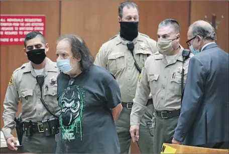  ?? Robert Gauthier Los Angeles Times ?? ADULT FILM star Ron Jeremy in Los Angeles Superior Court in June, when he was charged with sexually assaulting four women in West Hollywood. At right is his attorney, Stuart Goldfarb. Jeremy remains jailed in lieu of $6.6-million bail and has pleaded not guilty.