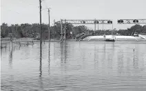  ?? NICHOLAS NEHAMAS Miami Herald ?? The Peace River overflowed its banks in Arcadia after Hurricane Ian.