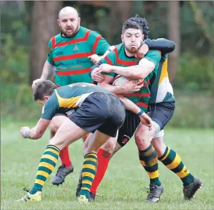  ??  ?? Lorne MacLachlan barges his way through the Helensburg­h defence.