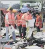  ??  ?? Investigat­ors examine parts of the Lion Air jet that crashed at Tanjung Priok Port.