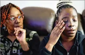  ?? MIGUEL MARTINEZ/MIGUEL.MARTINEZJI­MENEZ@AJC.COM ?? Brittany McElrathbe­y explains how a bullet damaged her face when she was shot Jan. 2. Family members called 911 and were put on hold, so her brother drove her to the hospital — an action they believe saved her life.