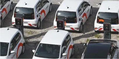  ?? ?? POWERED. Electric vehicles parked at charging stations on the grounds of energy supplier N-ERGIE in Nuremberg, southern Germany.