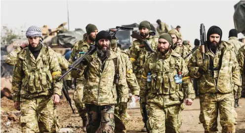  ?? Foto: AFP/Bulent Kilic ?? Als Bodentrupp­en schickt die Türkei mit ihr verbündete Milizen gegen die Kurden.