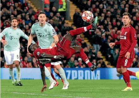  ?? AP ?? Liverpool’s Sadio Mane attempts an overhead kick which went wide of goalkeeper Manuel Neuer’s post.