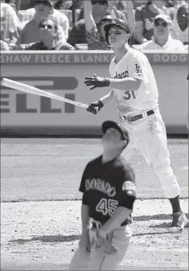  ?? Mark J. Terrill Associated Press ?? ENJOYING THE VIEW, Joc Pederson tracks the f light of his home run off of Rockies reliever Scott Oberg, the last of three Dodgers homers in the sixth inning.