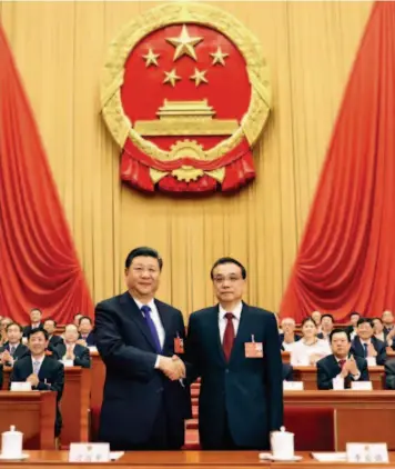  ??  ?? March 18, 2018: Xi Jinping (left, front) shakes hands with Li Keqiang at the sixth plenary meeting of the first session of the 13th National People’s Congress (NPC) at the Great Hall of the People in Beijing. Li Keqiang was endorsed as Chinese premier...