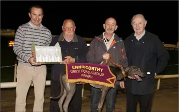  ??  ?? Piercestow­n Iron, winner of the Paradise Madison N1/N2 Unraced Stake final, with Barry Goff (racing manager), Seamus Whelan (owner), Stephen Parker (handler) and Christy Murphy (Chairman).