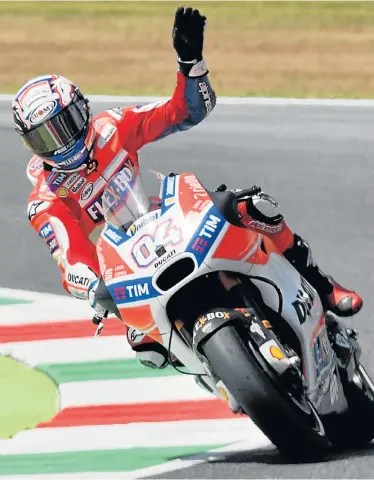  ?? Pictures: AFP ?? MAKING HISTORY: Ducati’s Italian rider Andrea Dovizioso celebrates after his MotoGP victory